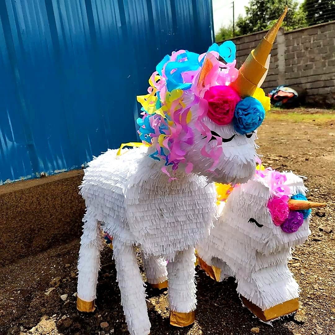 Unicorn themed pinata with curly mane for hire in Nairobi